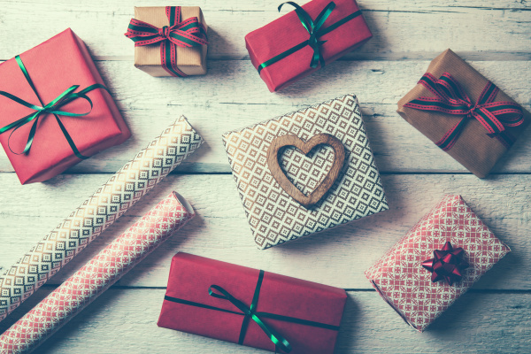 packed gifts and wrapping paper on