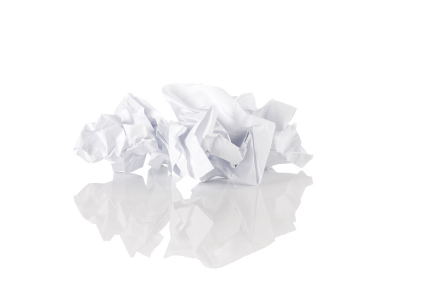 crumbled paper over white background