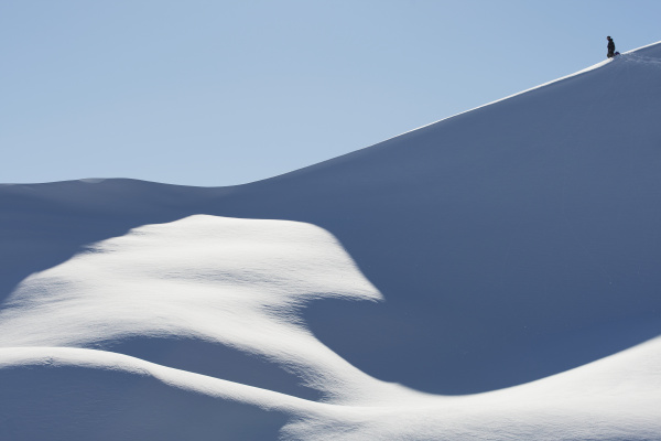 snowboarder on a snowy slope against