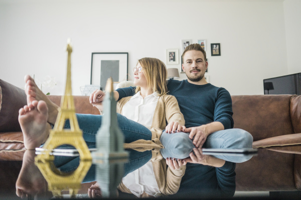 couple sitting on couch at home