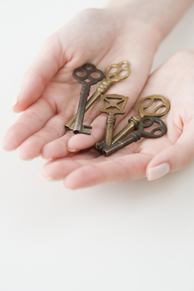 old fashioned keys in womans hands
