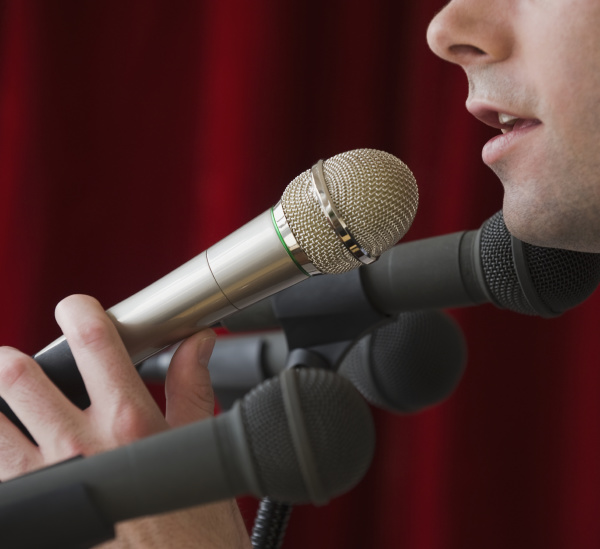 man speaking into microphone