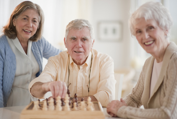 senior adults playing chess