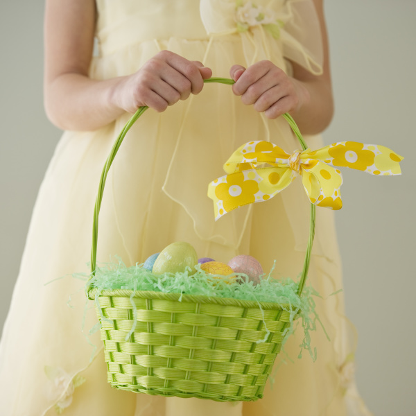 young girl holding a basket of