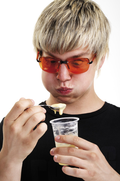 young man with sunglasses and yogurt