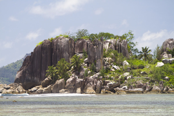 granite formations with coconut palms