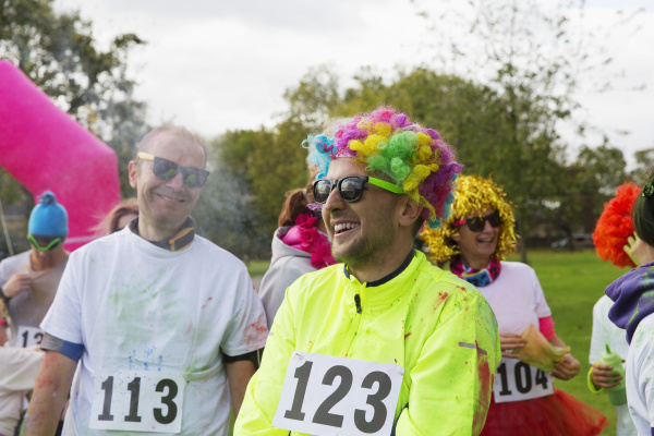 playful runner in wig at charity