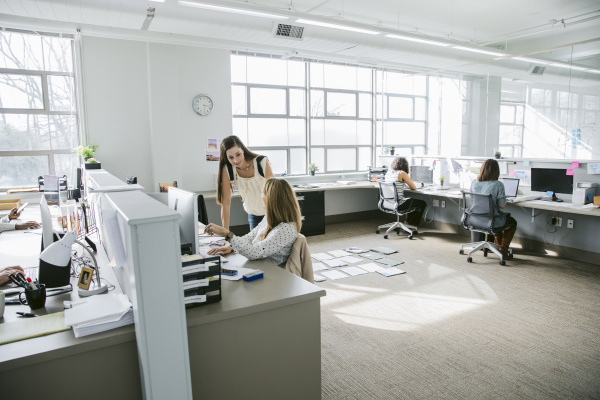 businesswomen working at desks in office