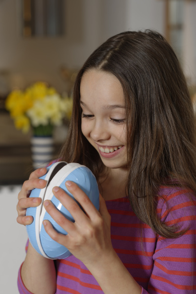 girl looks into a big easter