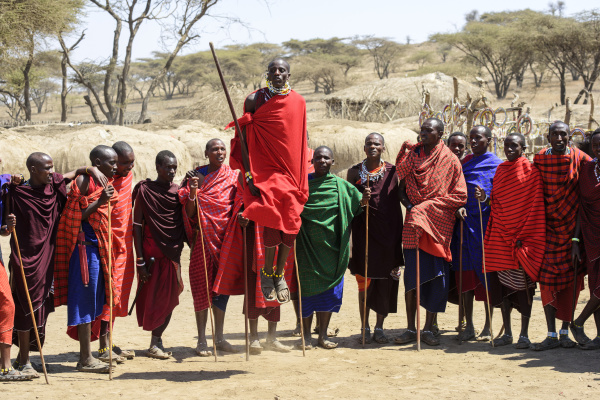 maasai warriors wearing brightly coloured clothing