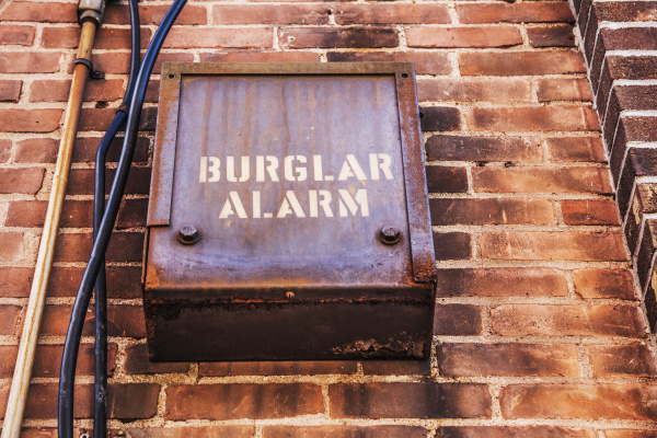 burglar alarm on the side of