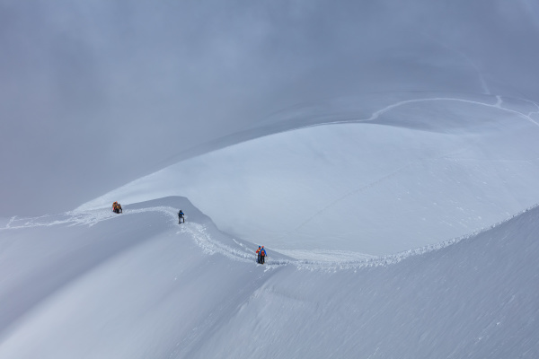 climbers on the mont blanc massif