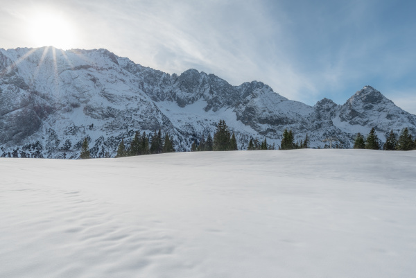 austrian alps with snow and sunshine