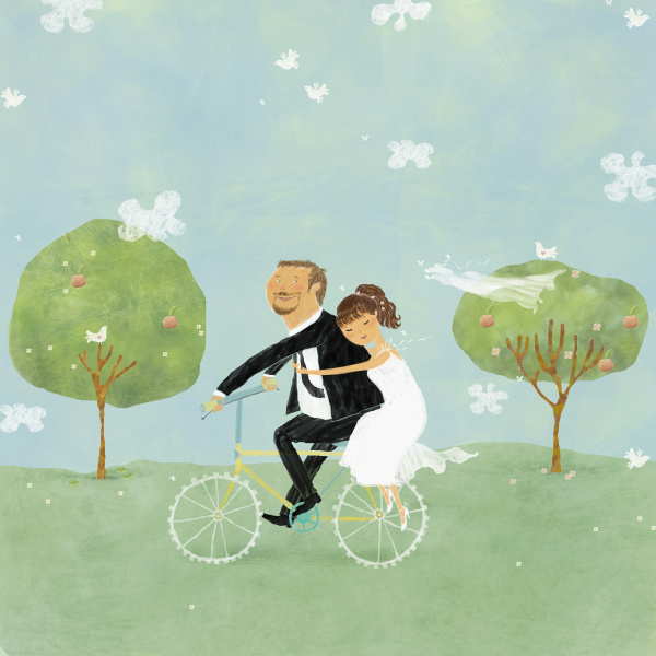 bride and groom on bicycle in