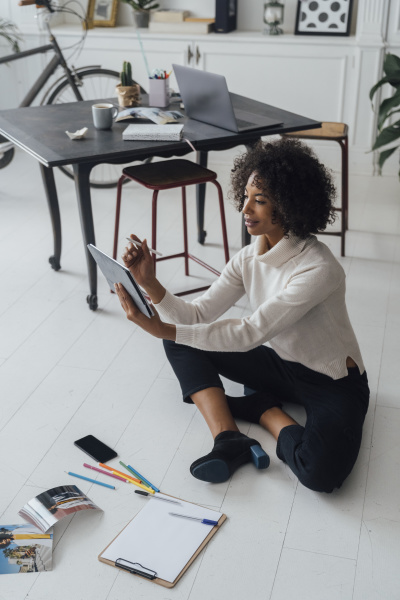 disigner sitting on ground of her