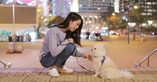 woman go out with her dog