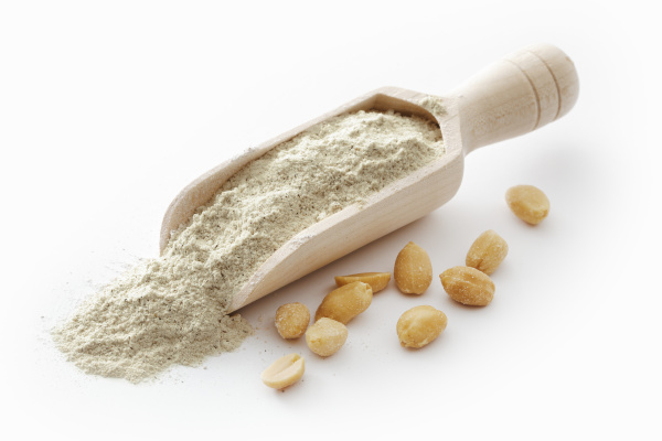 peanut flour on a wooden scoop