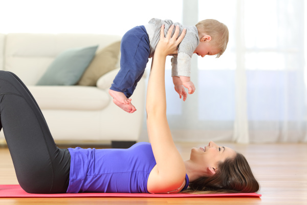 mother exercising with her baby at