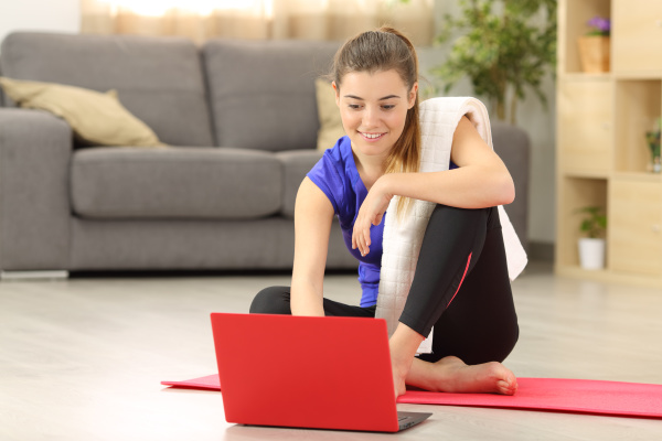 fitness woman selecting tutorial before exercise