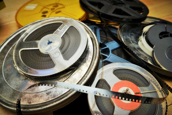 old film reels on a wooden