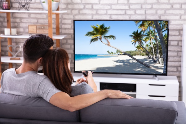 couple watching television at home