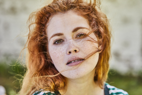 portrait of redheaded young woman with