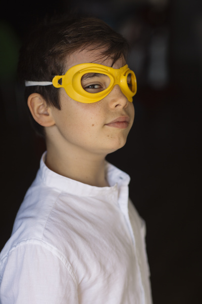 boy wearing yellow eye mask