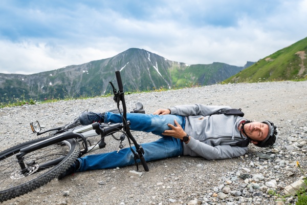 man after accident on mountain bike