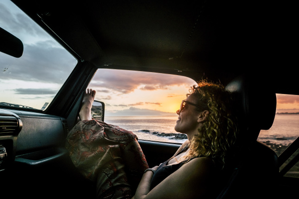 woman in car with her legs