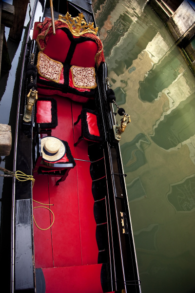 small canal red black gondola close