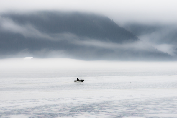 a lone fisher boat heading out