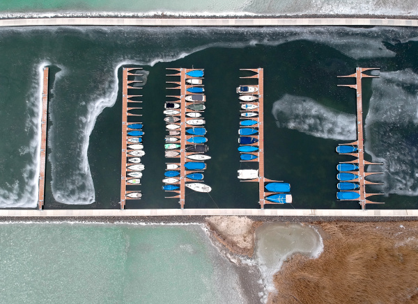 boats frozen in the water on