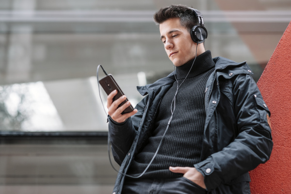 young man with smartphone and headphones