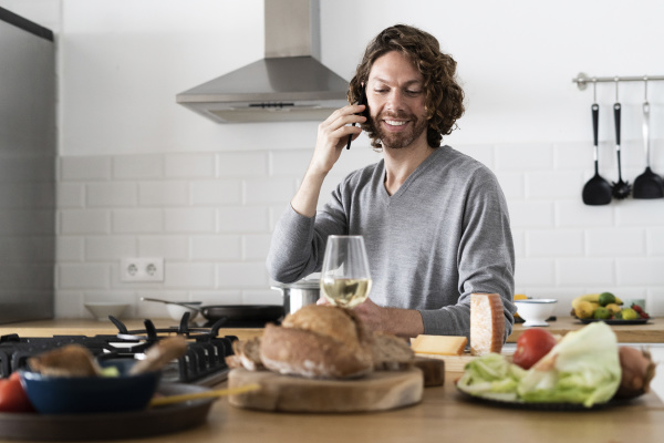 man on the phone in kitchen