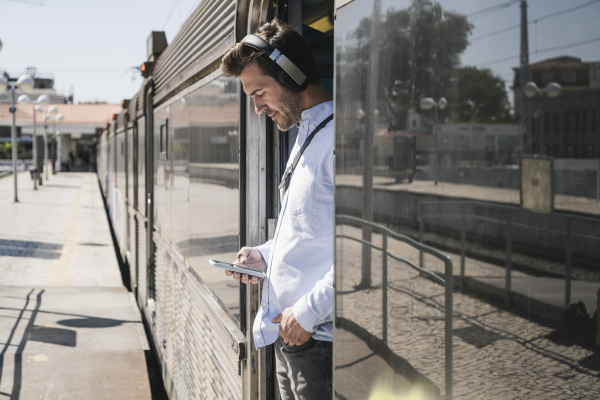 young man with headphones and smartphone