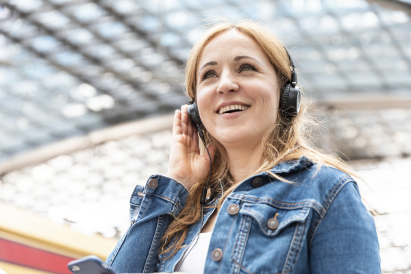 happy woman listening to music with