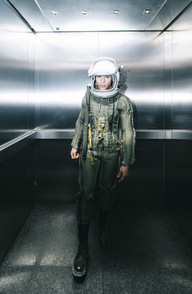 man posing dressed as an astronaut