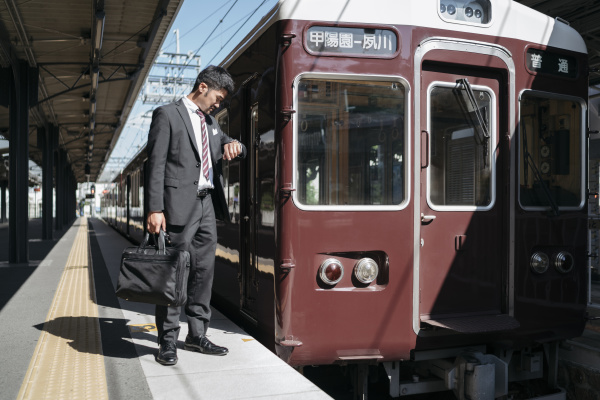 young businessman on a train platform