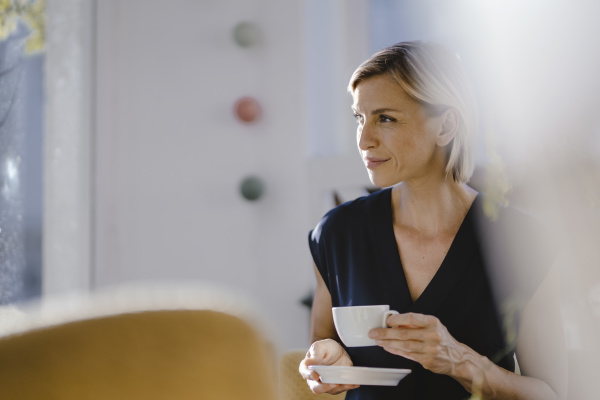 businesswoman drinking cup of coffee