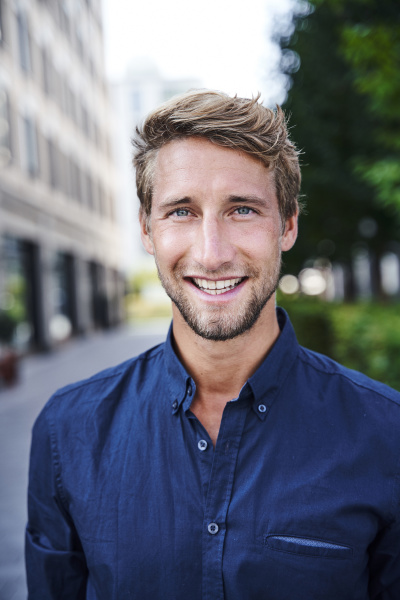 portrait of smiling young businessman in