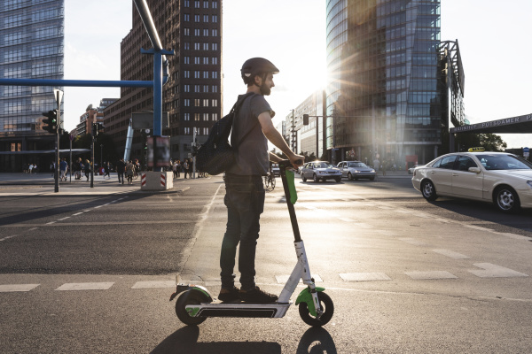 man using e scooter in berlin
