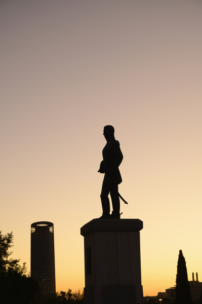 silhouette of statue at sunset in
