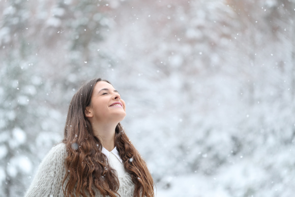 happy girl enjoying a snowy day