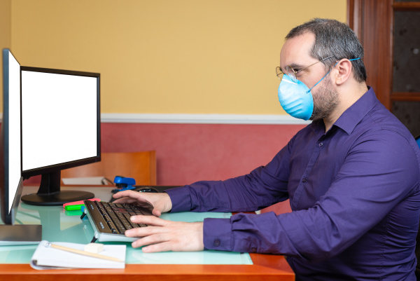 man with medical mask working