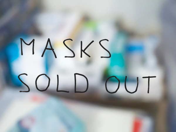 masks sold out sign blurred