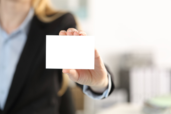 executive hand showing blank business card