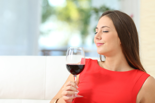 satisfied, woman, smelling, a, red, wine - 28278087