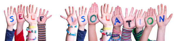kids hands holding word self isolation
