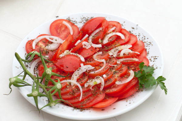 slices of tomatoes with the onion