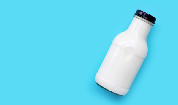 milk bottle on blue background
